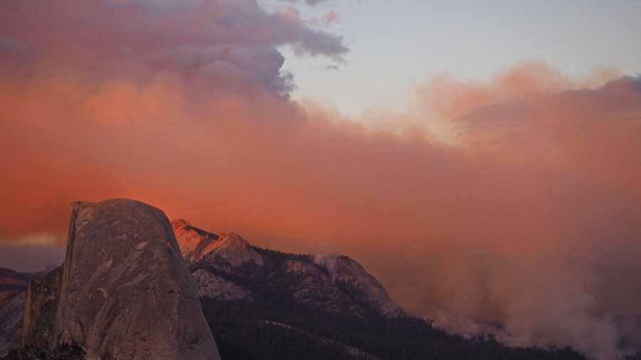 The fire sent smoke into Yosemite Valley, from where the park's famous high granite summits, Half Dome and El Capitan, are visible.