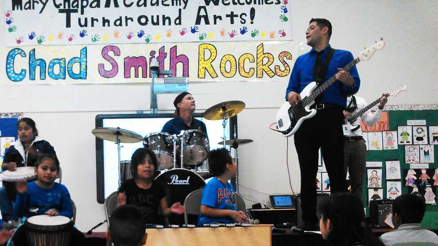 Chad Smith, Red Hot Chili Peppers drummer, plays at Mary Chapa Academy in Greenfield Thursday. 