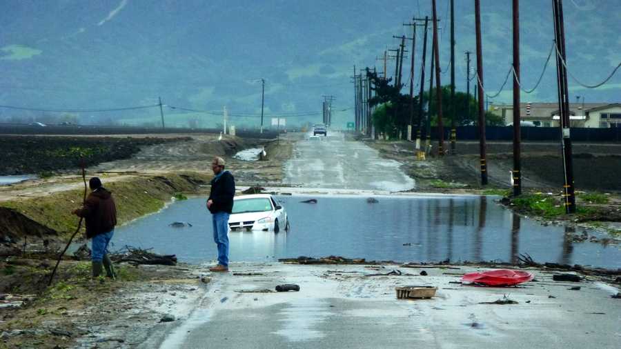 A partially submerged car was found on a heavily flooded Alisal Road near Hartnell Road in Salinas during the Dec. 11 storm. 