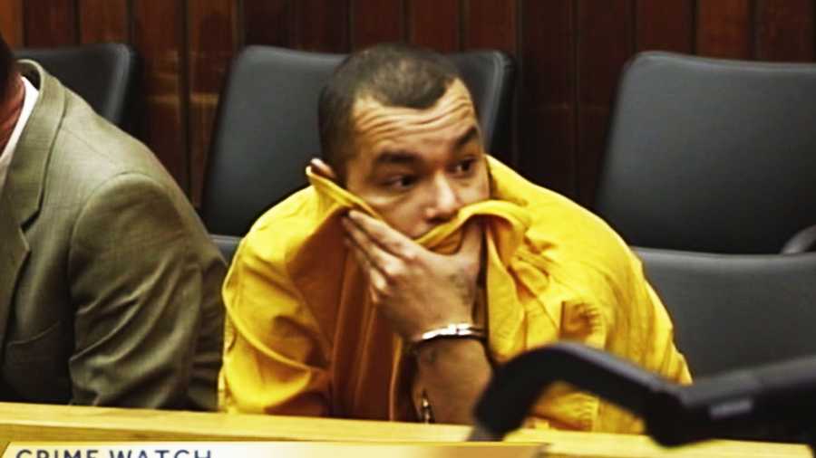 Jimmy Fernando Espinoza tried to hide his face during his first court appearance in Santa Cruz on Dec. 17. 
