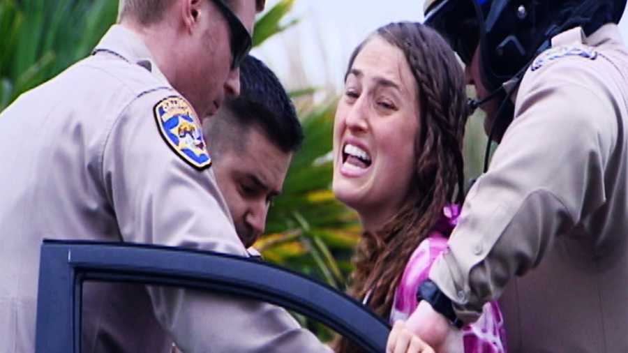 Carey was screaming "Jesus! Help! They are taking my children! I want my babies," while CHP officers put her in handcuffs in Aptos.  (Feb. 5, 2015)