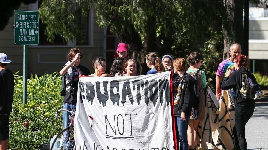 A banner reads, "Education Not Incarceration." Students said the state is funneling too much money into prisons, and not enough into higher education. (March 3, 2015)