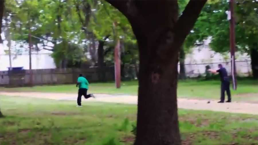 Officer Michael Slager, right, is seen here shooting a feeling, unarmed man to death. 