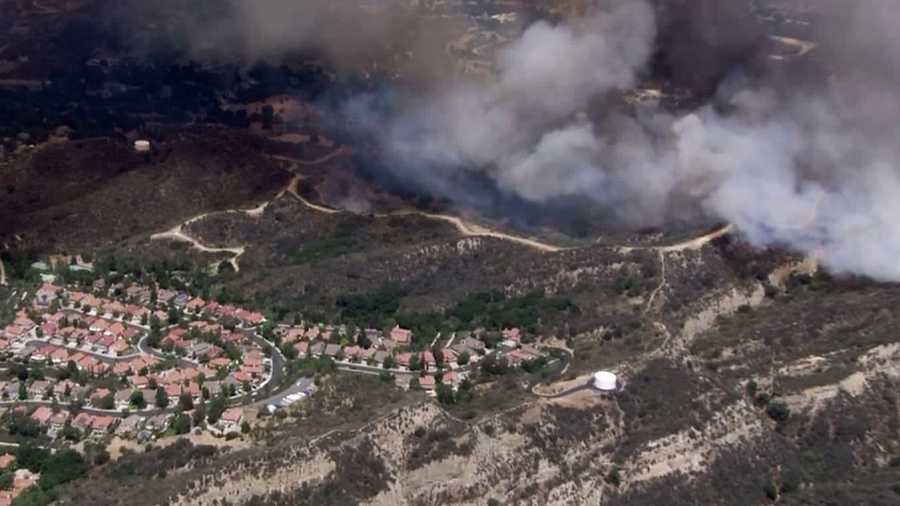 A fire threatened homes in Santa Clarita. (June 24, 2015)