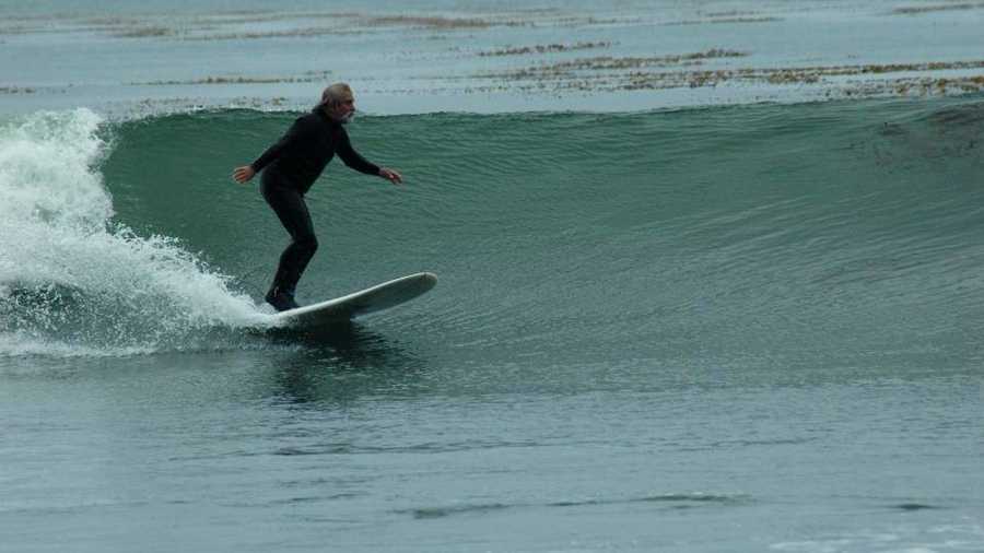 Scott Woodworth is seen surfing in December. 