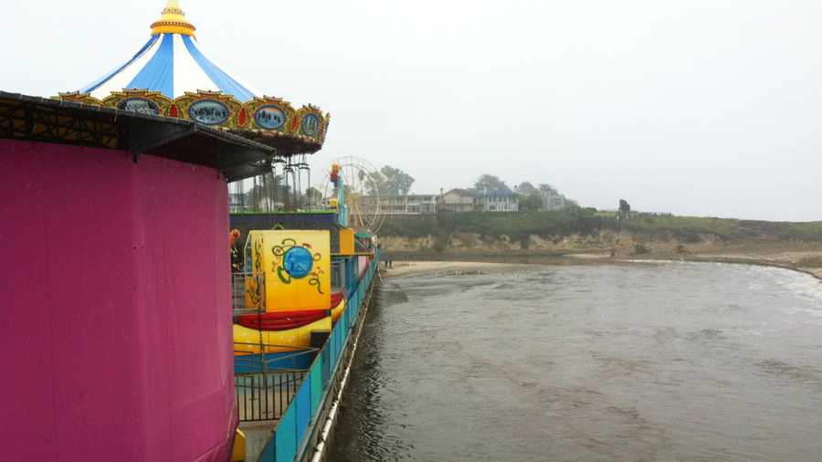 The San Lorenzo River came close to flooding the Santa Cruz Beach Boardwalk after Wednesday's storm. (March 15, 2012)