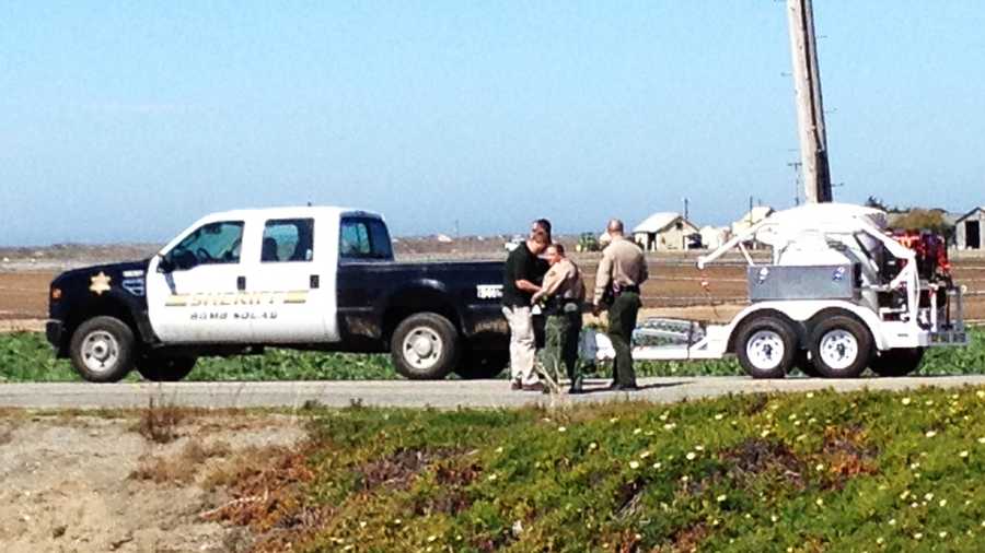 A bomb squad investigates a suspicious device inside a sport utility vehicle near Castroville Wednesday. (March 21, 2012)