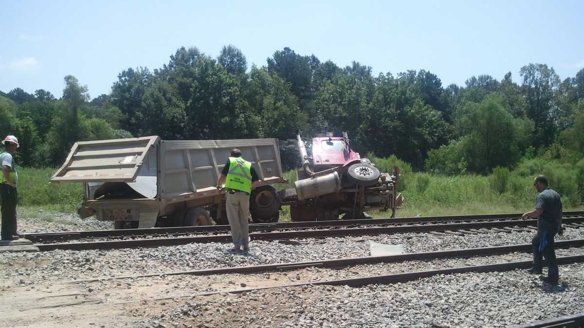 1 injured when passenger train hits dump truck