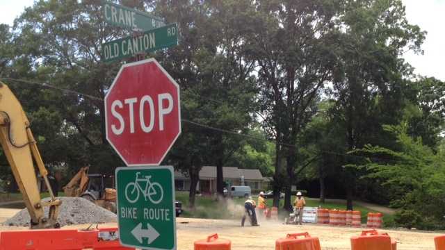Crews work to repair Old Canton Road sinkhole