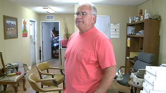 Victor Dorman spent Wednesday morning cleaning up his auto sales office after it was trashed by thieves.