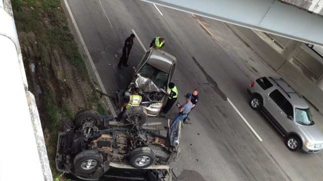 One person is injured on Interstate 55 northbound after a Nissan Xterra fell off a car carrier causing a crash with another vehicle.