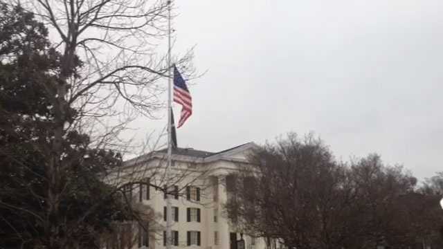 The flag flies at half-staff outside City Hall, the day after Mayor Chokwe Lumumba died.
