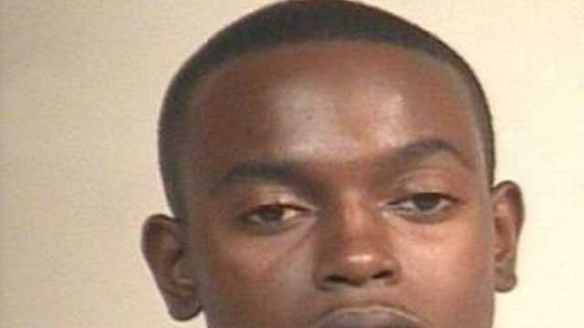 Man wanted on murder charge surrenders to police