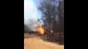A natural gas line burns in a rural area west of Raleigh.