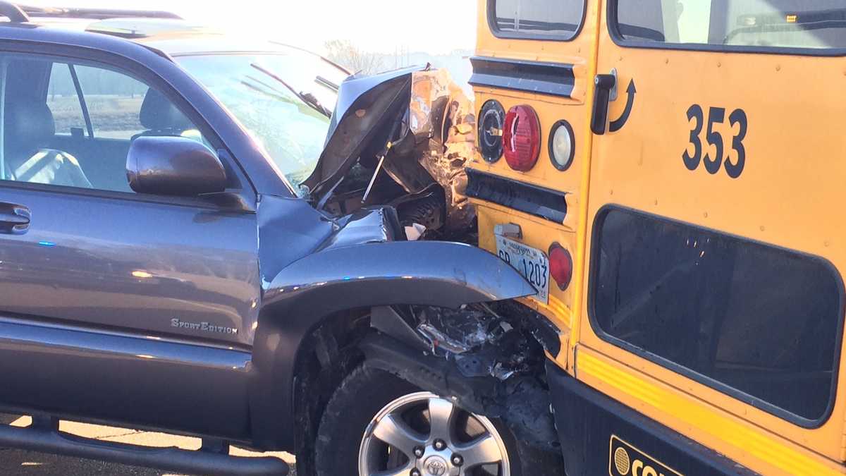 SUV collides with school bus