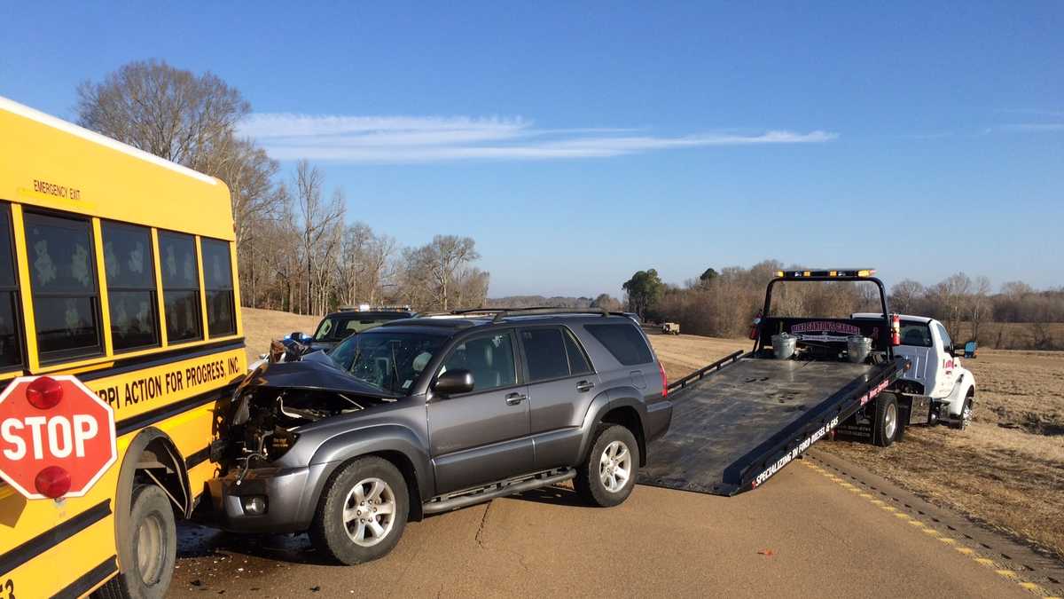 SUV collides with school bus