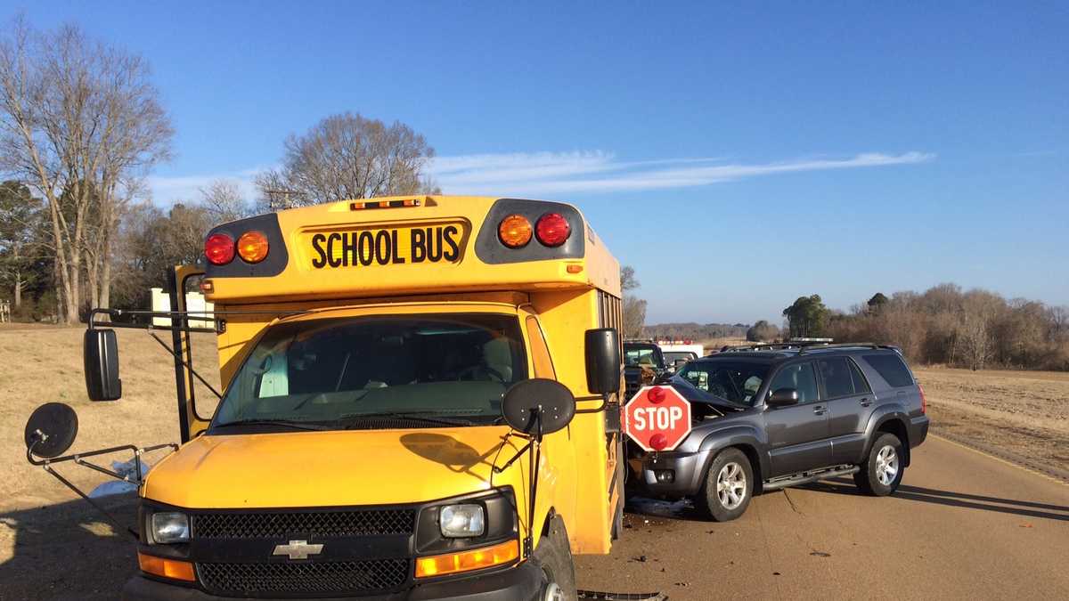 SUV collides with school bus