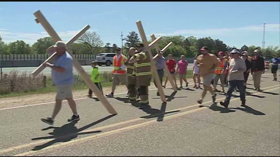 church members carry crosses