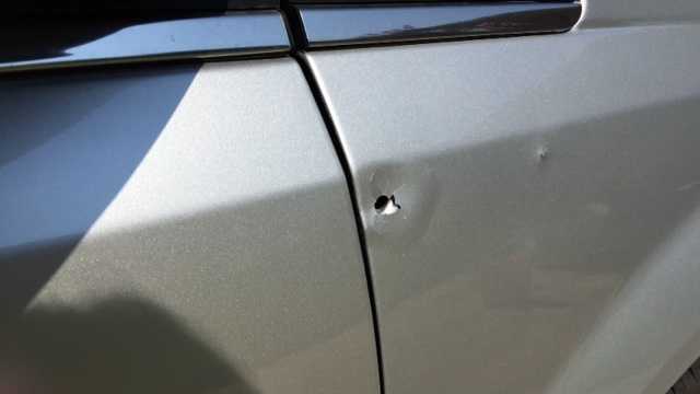 One bullet hit a car and the other a house.