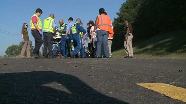 Driver seriously injured when car collides with school bus