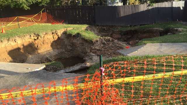 Huge sinkhole opens up behind Jackson apartment complex