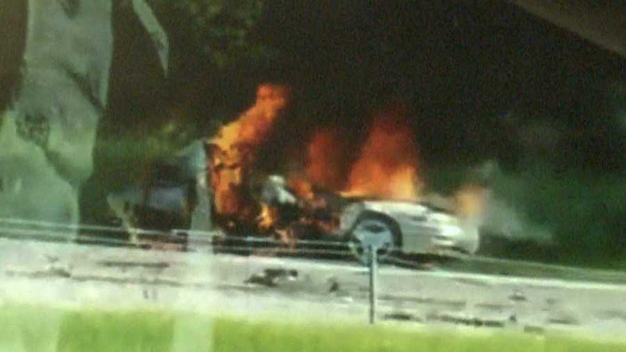 A still from a video captured by a witness shows one of the cars involved in the crash engulfed in flames.
