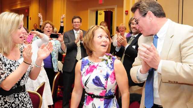 Martha Gardner reacts to the surprise announcement naming her teacher of the year.