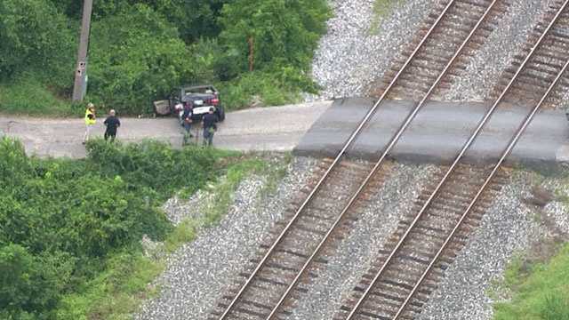 In photos: CSX train collides with car, injures 1 in Rosedale