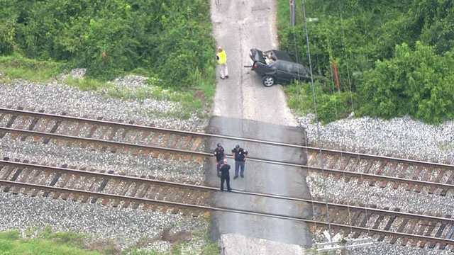 In photos: CSX train collides with car, injures 1 in Rosedale