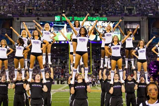 Photo: Ravens cheerleaders in holiday outfits perform against