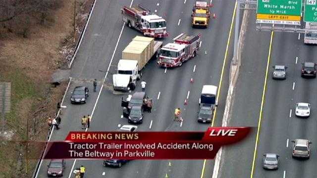 Tractor-trailer crash halts traffic on Outer Loop