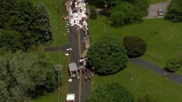 Photos: Tanker overturns, spills fuel on county road