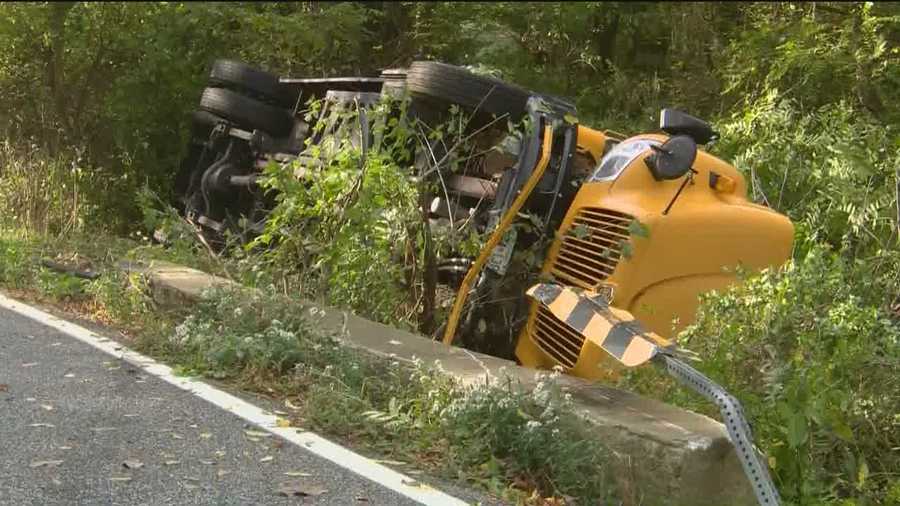 Police said six people were injured after a school bus heading to Pikesville Middle School overturned Friday morning in Baltimore County.