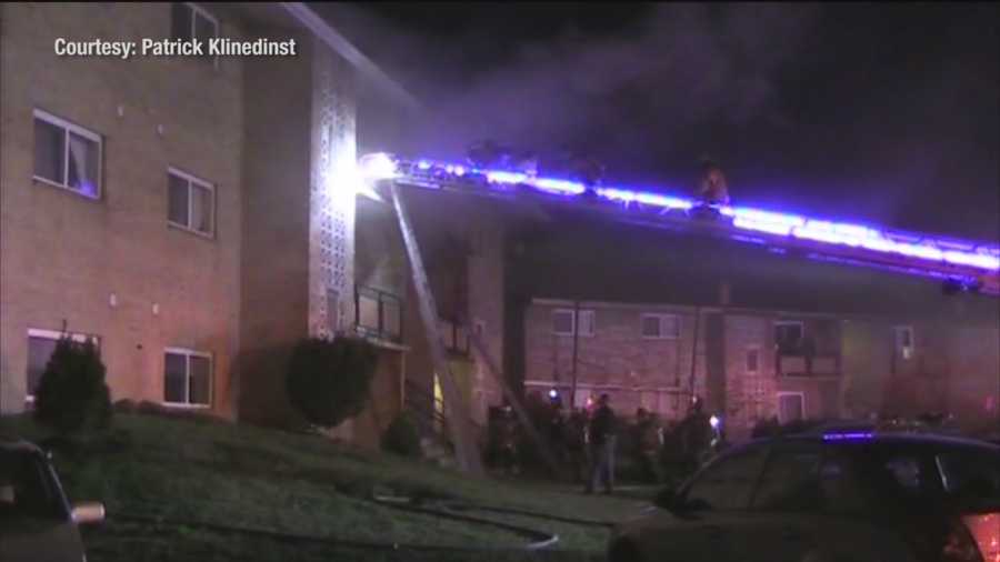 A two-alarm fire displaces 18 people in Dundalk and injures three people, including a firefighter.