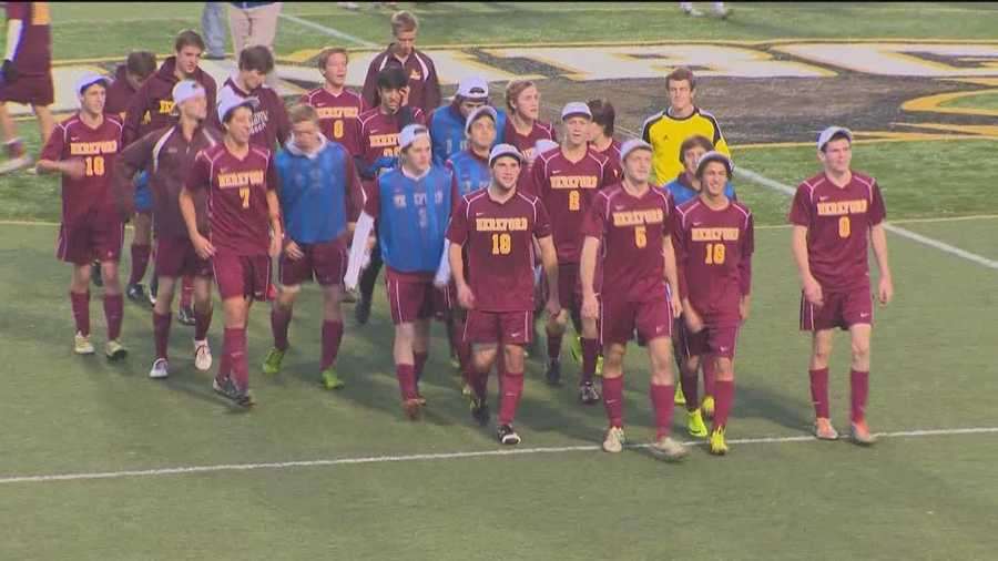 The Hereford High School varsity soccer team walks off the field after winning the 2013 state championship. 