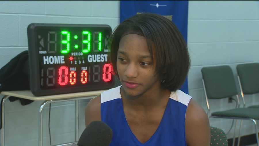 Janya Lilly is a middle-schooler in east Baltimore who is holding court as the co-captain of the boys' basketball team at her school. 