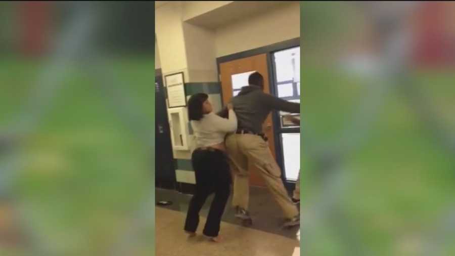 A Baltimore teacher is on administrative leave and a student is facing charges after a fight inside a school is caught on camera.