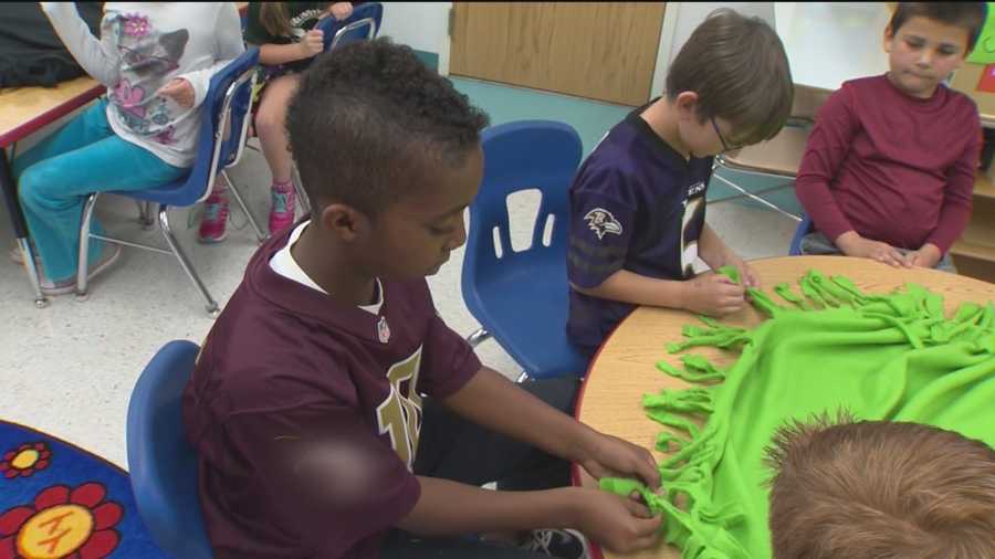 Students who make blankets for sick kids honored
