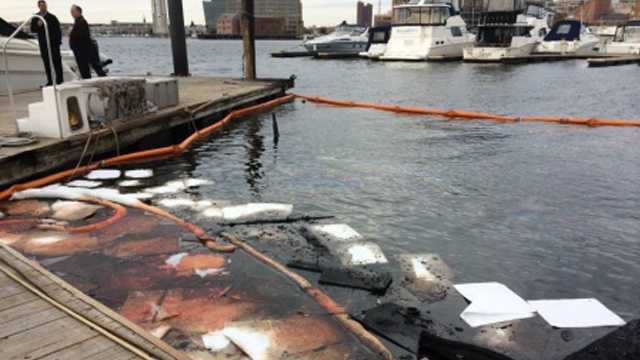 Debris and oil can be seen in the water where one of the boats sank.