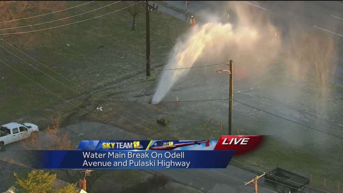 Water main break gushes water into air
