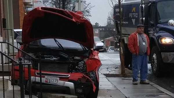 Car crashes into steps of Baltimore home