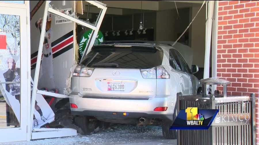 A vehicle slammed into a Towson Starbucks injuring four people, official said.