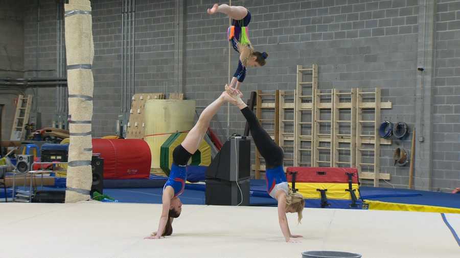 Gymnasts at Emilia's Acrobatics in Columbia practice in preparation for competing in the World Acrobatic Gymnastics Championships in China.