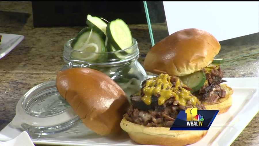 Chef Adam Williams with the Baltimore Marriott serves up his pulled beef brisket sandwich.