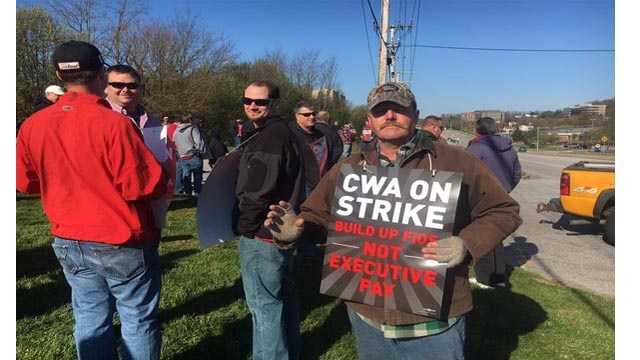 Verizon workers walk the picket line outside a Verizon location in Cockeysville. The group is among the 39,000 Verizon workers that went on strike on Wednesday.