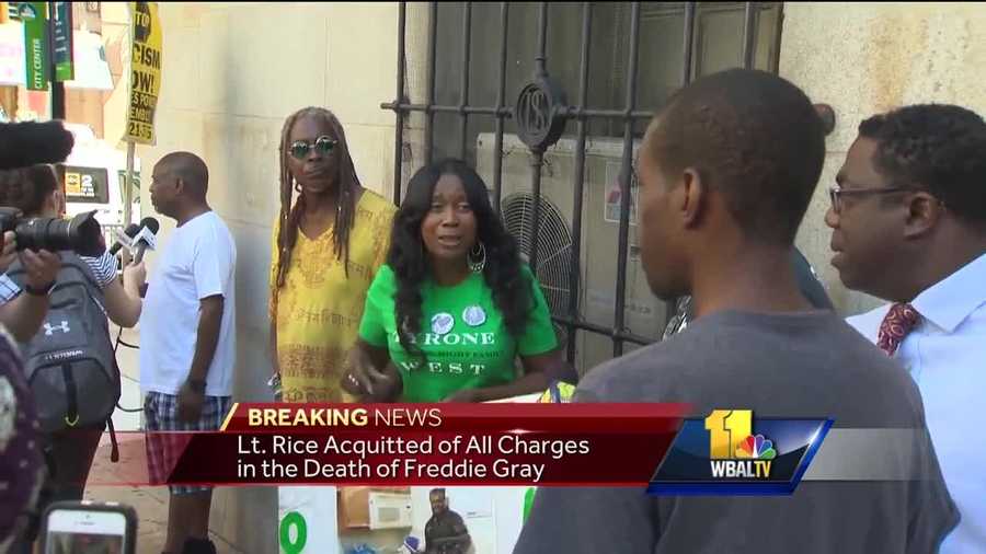 A small group of protesters stood outside Courthouse East after Baltimore Police Lt. Brian Rice was found not guilty on all charges connected with the death of Freddie Gray.