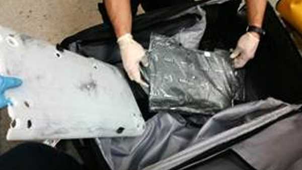 CBP officers arrested Jamaican woman Trudian James after officers found this cocaine in her baggage at BWI on on Monday. The cocaine and packaging weighed about 1,300 grams or nearly 2 pounds, 14 ounces. It has a street value of about $90,000.