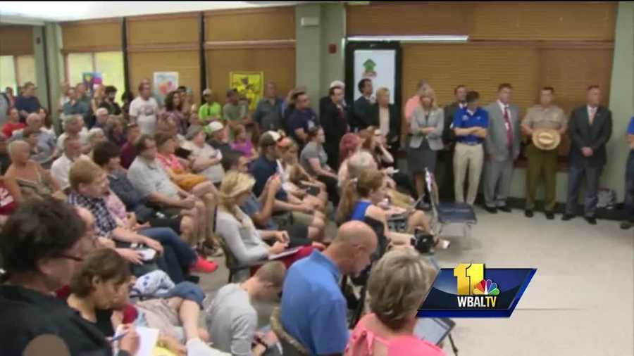 A packed crowd poured into the Ellicott City 50+ Center to meet with government officials as they seek answers on how to move forward after having their businesses, property or cars damaged or destroyed after Saturday's record flood.