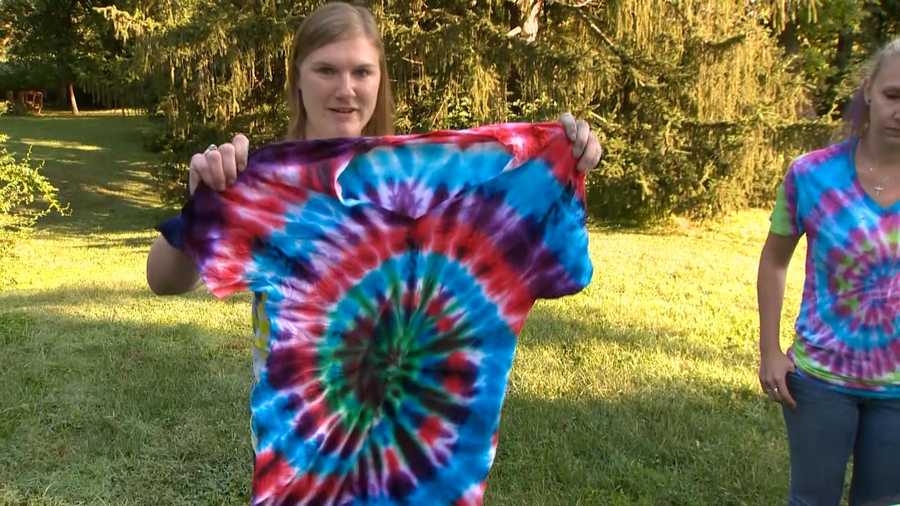 Liz Liem and her cousin, Sarah Jones, are tie dying shirts for sale with the proceeds going to help the victims of the flooding in Ellicott City.