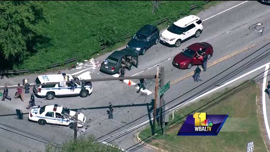 Baltimore County police have shot and killed a man they described as a bank robbery suspect, and another man in custody has been identified as the "Aviator" bank robbery suspect sought by the FBI. This started after the Wells Fargo Bank in the 1500 block of Reisterstown Road in Pikesville was robbed around 1 p.m. A police sergeant was stopping traffic to check for suspects at the intersection of Falls and Ruxton/Old Court roads. Around 1:20 p.m., police said a car pulled out of the line of stopped traffic, crossed the center line and drove toward one of the officers.